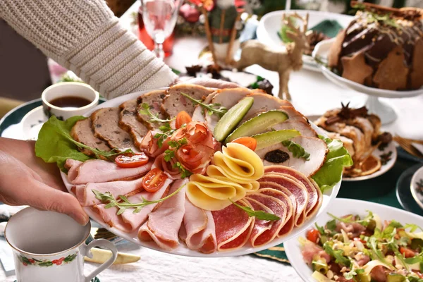 Person Putting Platter Sliced Ham Salami Cheese Cured Meats Christmas — Stock Photo, Image