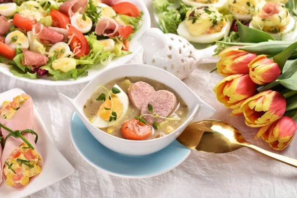 Easter Table Traditional Soup White Borscht Sausage Fresh Salads Eggs Imagen de archivo