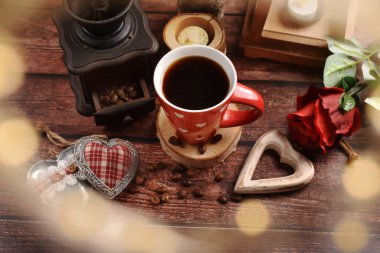 Valentine's time with a cup of coffee in rustic style on wooden table 