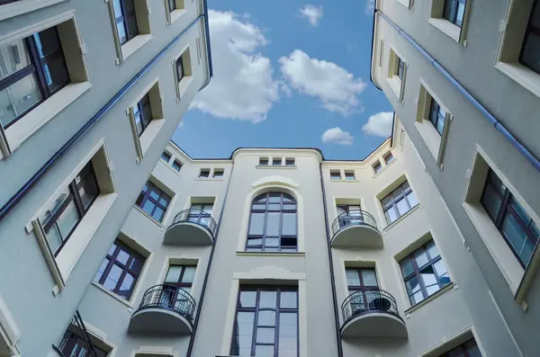 stock image Beautiful old building with apartments after renovation seen from the courtyard