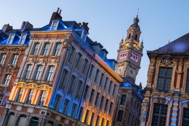 Antique renaissance buildings and the belfry of the Chamber of Commerce in Lille, France clipart