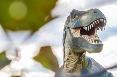 Scary Tyrannosaurus Rex or T-Rex cretaceous dinosaur, photography  with a blurry foreground