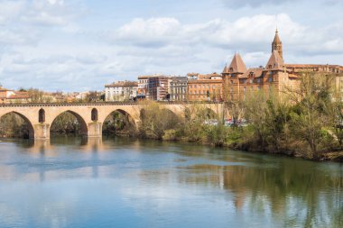 View at the Tarn river with old bridge in Montauban, France clipart