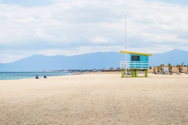 Lifeguard tower and beach at the coastline of the Mediterranean sea in Port Barcares, France clipart