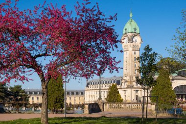 View of the famous Limoges train station called Limoges-Bndictins and flowering tree clipart