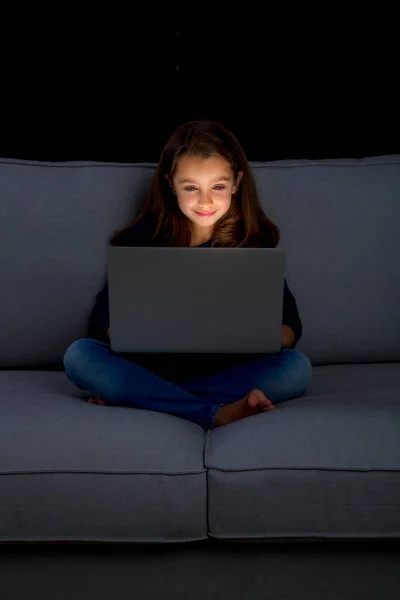 Little Girl Working Laptop Seated Sofa — Stock Photo, Image