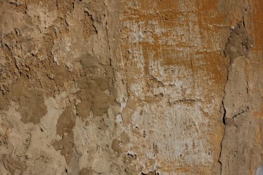 Kahverengi alçı duvar dokusu ve arka planı olan eski beton..