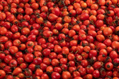 bir yığın kırmızı gül gül gül meyvesi tam çerçeve arkaplan ve doku.