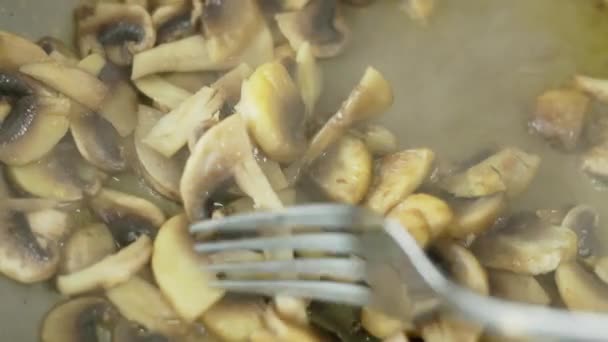 Fresh Champignon Mushrooms Stirring Stainless Steel Fork Frying Pan Slow — Stock Video