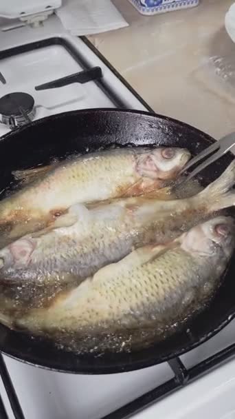 Woman Hand Poking Carving Fork Whole Vobla Fish While Frying — Video Stock