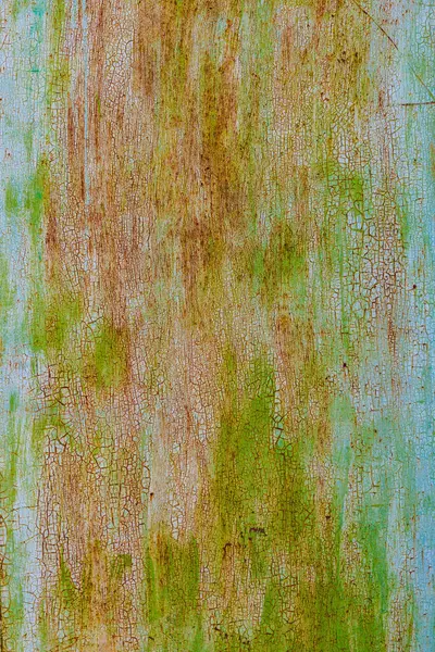 faded green paint on surface of flat sheet steel with stains of rust - full-frame background and texture.