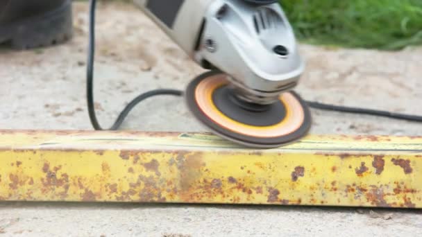 Yellow Rusted Square Steel Pipe Being Cleaned Angle Grinder Flap — Stock Video