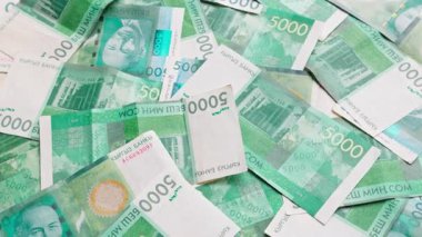 5.000 Kırgızistan Som banknotunun döner arkaplanı, tam kare döngüsel arkaplan