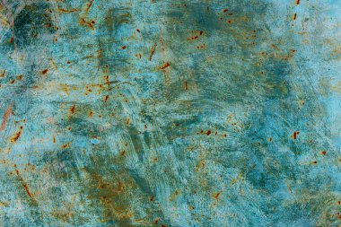 Weathered metal surface with rust and faded green paint - full-frame background and texture