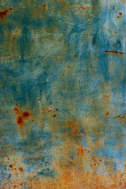 Faded green flat metal surface with rust spots and brush strokes