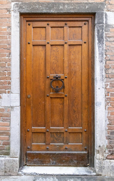 Antique wooden door with metal door handle