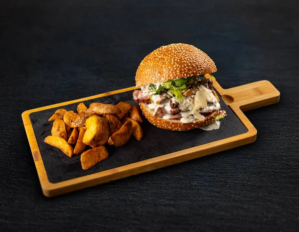 Juicy Appetizing Burger Steak Cheese Sauce Greens Served Potato Wedges — Stock Photo, Image