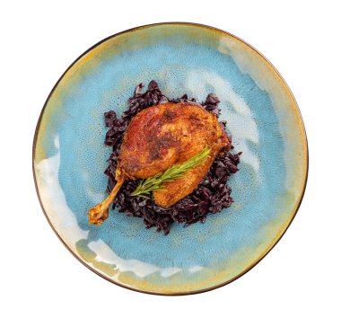 Grilled confit duck legs served with braised red cabbage
