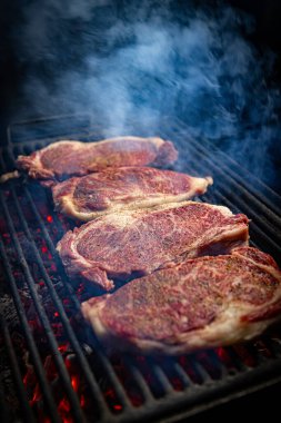 Close up of wagyu entrecote beef grilled steak. Beef steaks on grill clipart