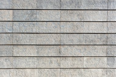 Gri granit taşlardan yapılmış bir duvarın arka planı