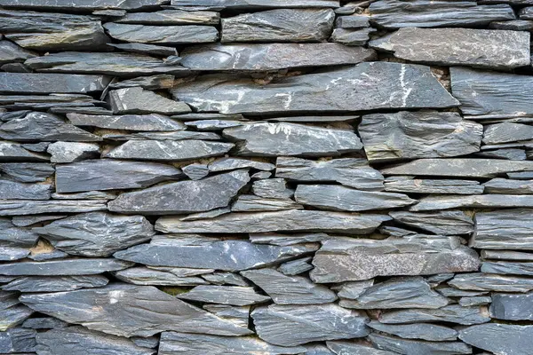 Background from an old natural slate stone wall