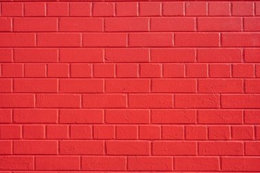 Kırmızı boyalı tuğlalardan yapılmış bir duvarın arka planı