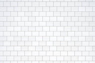 Dikdörtgen beyaz taş levhalı bir duvarın arka planı