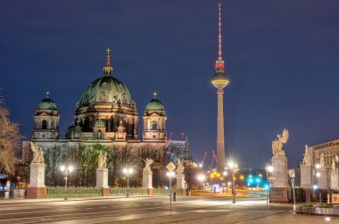 The Berlin Cathedral and the famous TV Tower at night clipart