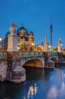 The Berlin Cathedral with the famous TV Tower at twilight clipart