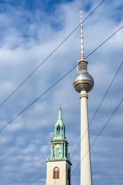 stock image The famous TV Tower in Berlin with the overhead wires of the tramways