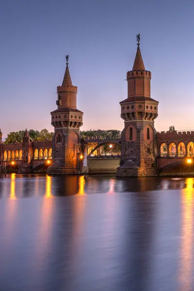 stock image The beautiful Oberbaumbruecke over the river Spree in Berlin at twilight