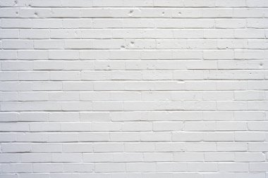 Beyaz boyalı tuğlalardan yapılmış bir duvarın arka planı