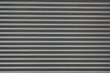 Bükülmüş gümüş bir metal levhanın arka planı