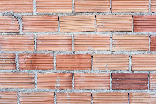 Alçısız yapı taşlarından oluşan bir duvarın arka planı