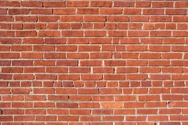 Eski kırmızı tuğlalardan yapılmış bir duvarın arka planı