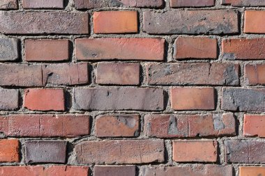 Kırmızı bir tuğla duvarın arka planı