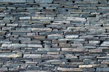 Eski bir doğal taş duvarın arka planı