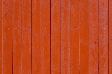 Boyalı kırmızı bir tahta duvarın arka planı