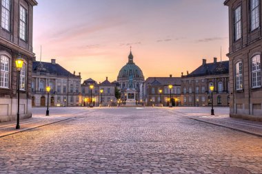 The Amalienborg Palace and the Marble Church in Copenhagen, Denmark, just after sunset