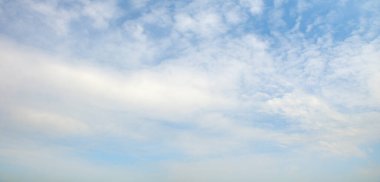 Blue sky and thick white clouds.