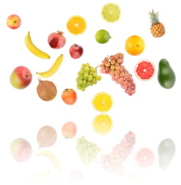 Falling colorful vegetables and fruits with light reflection isolated on white background.