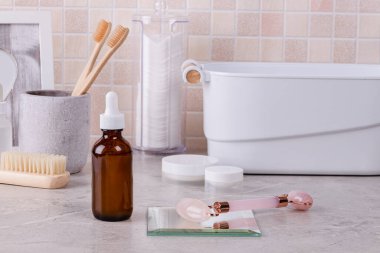 Home skin care, SPA. Hyaluronic moisturizing serum on the bathroom shelf. Simple steps for healthy skin