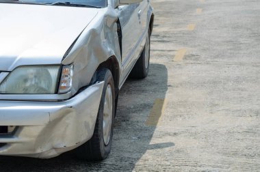 a scared marks on a front-left car body from accidentally hit by fast drive motorcycle, show broken mirror of flashlight cover 