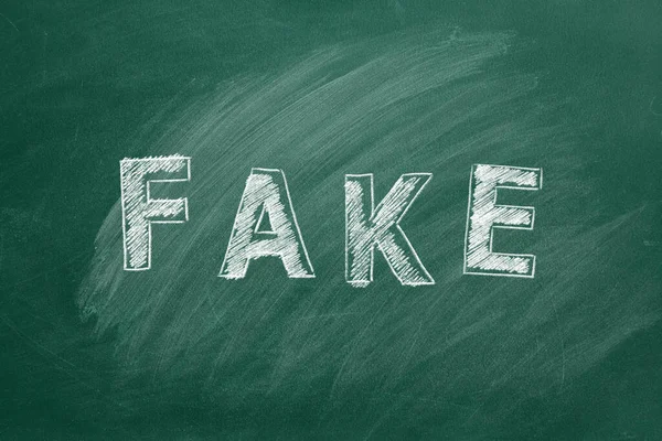 Word Fake Written Chalk Greenboard Information Disinformation Concept Fake News — Fotografia de Stock
