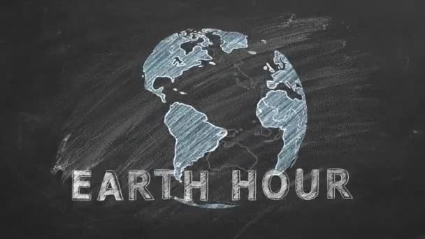 Obrotowy Glob Napisem Earth Hour Strony Rysowane Kredą Tablicy Szkolnej — Wideo stockowe