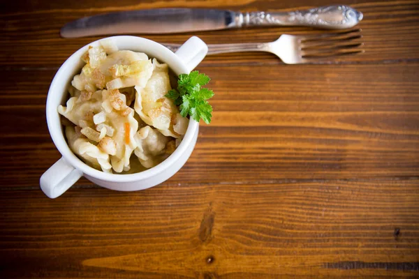 Cooked Dumplings Potatoes Fried Onions Bowl Wooden Table — Stock Photo, Image
