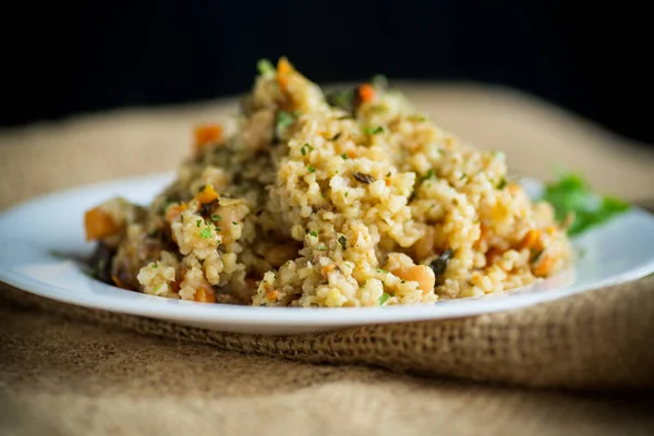 Cooked Bulgur Vegetables Carrots Dried Mushrooms Plate Wooden Table — 图库照片