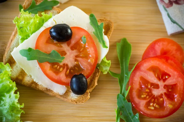 Fried Toasts Mozzarella Lettuce Tomatoes Herbs Wooden Table — Stock Photo, Image