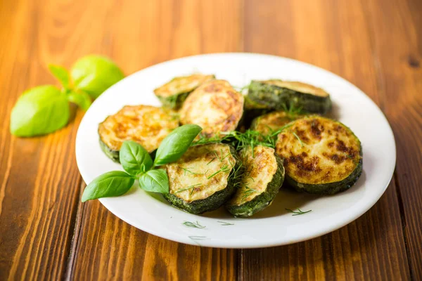 Zucchini Fried Circles Spices Herbs Plate Wooden Table — Stock Photo, Image