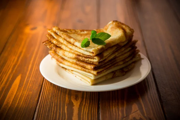 Lot Pancakes Thin Pancakes Plate Dark Wooden Table — Stock Photo, Image